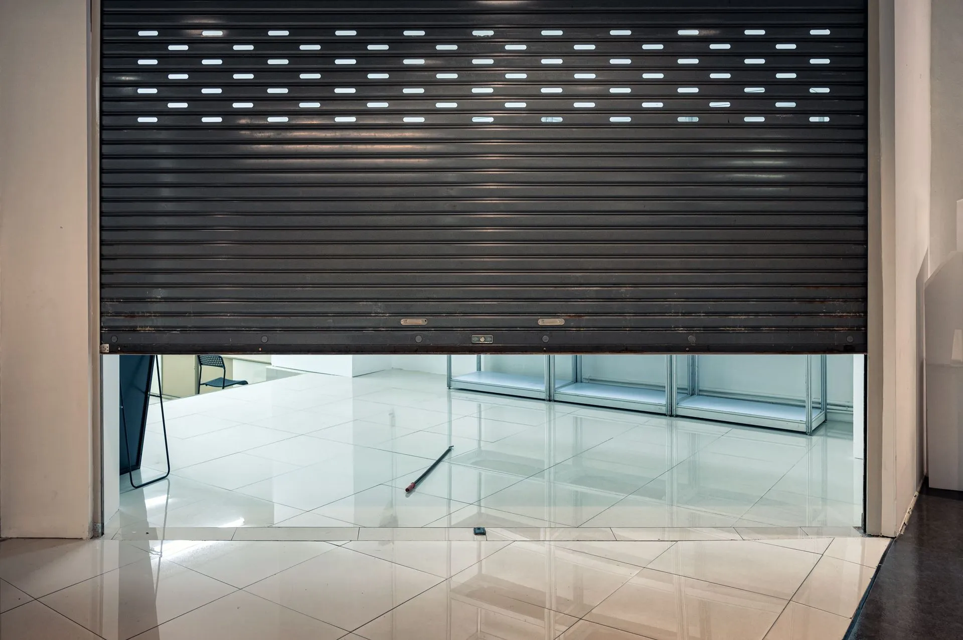commercial shutter with perforated slats for ventilation.