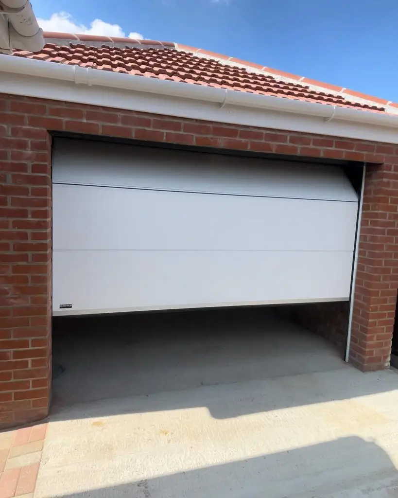 CarTeck Sectional Garage Door In White Opening