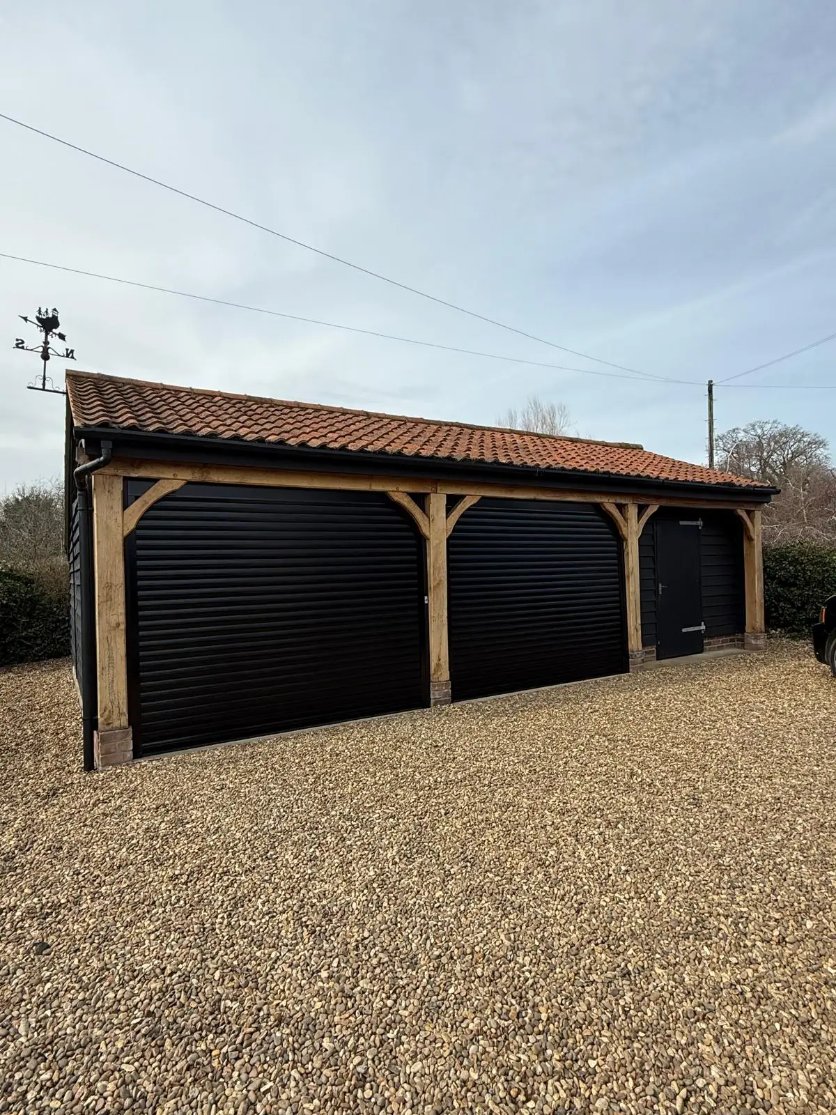 Pair Of Jet Black Deluxe Roller Doors In Dereham